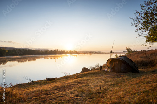 Fishing adventures, carp fishing in sunrise. photo