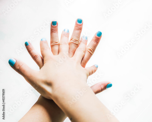 female hands applying hand sanitizer gel and cleaning them photo