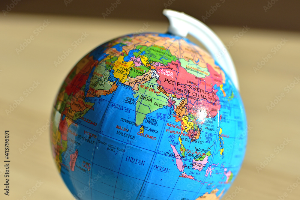 Closeup of small globe focused on India, Pakistan, Nepal, Sri Lanka, Maldive, Indian ocean, blurred background Closeup of small globe focused on India, Pakistan, Nepal, Sri Lanka, Maldive, Indian ocean, blurred background