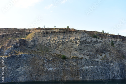 Sheer cliff with lake at the bottom