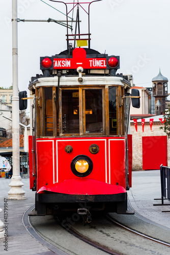 Nostalgic red tram in Taksim Square. Istiklal Street is a popular touristic destination in Istanbul, Turkey.  .