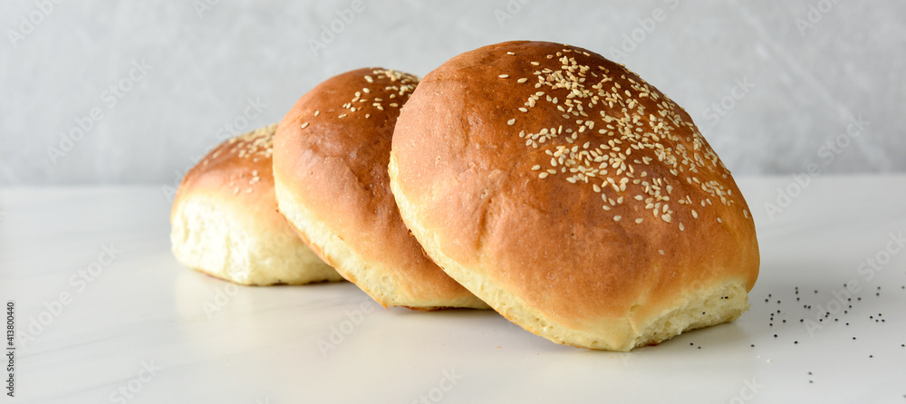 fresh baked buns with sesame and poppy  seeds