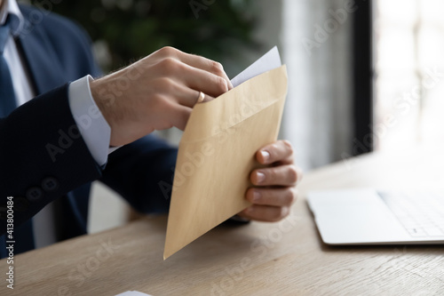 Canvas Print Crop close up of male employee or CEO sit at table open envelope with postal letter or mail