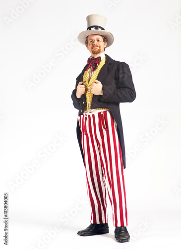 Portrait of man in uncle Sam costume against white background photo