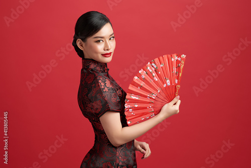 Принти на полотні Asian chinese woman in traditional dress on red background