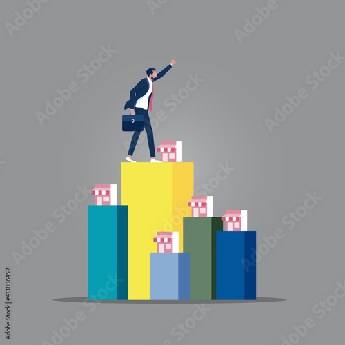 Concept of business franchise, businessman want to expand his business, Businessman on top of successful franchise. Franchise, trading network