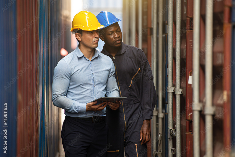 industry staff is inspecting the containers at the warehouse. industry staff is inspecting the containers at the warehouse.