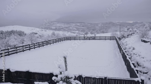 Snowscape Equestrian Facility Of Potcoava Mountain Hideaway At Runcu, Romania. - Aerial Wide Shot photo