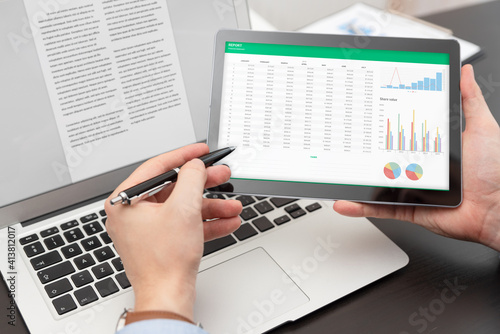 Fotografie Budget planning, spreadsheet on tablet screen