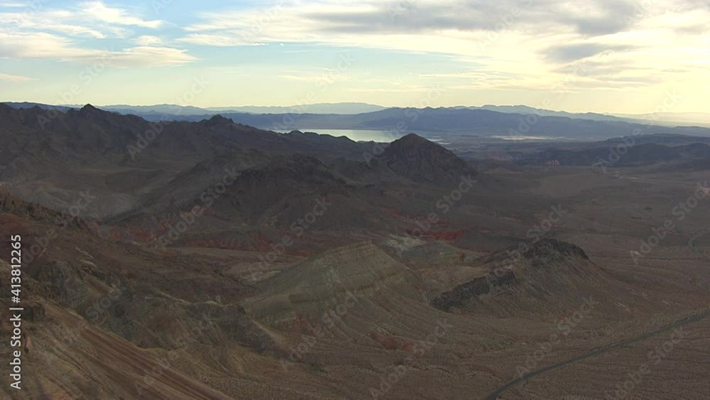 eroded red soil exposed around Lake Mead in the USA. Travel towards the lake in a wide angle shot during daylight. helicopter shot with gyrostabilised system eroded red soil exposed around Lake Mead in the USA. Travel towards the lake in a wide angle shot during daylight. helicopter shot with gyrostabilised system