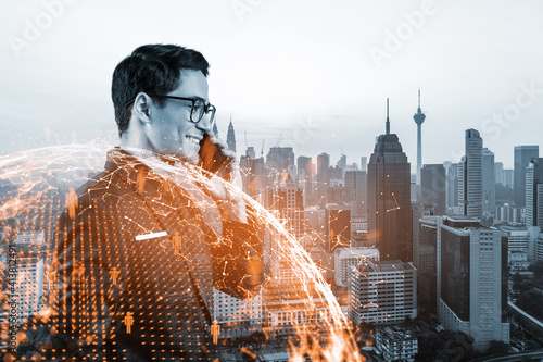 Photography A young handsome eastern businessman processing conference call to develop social media marketing strategy to achieve business goals