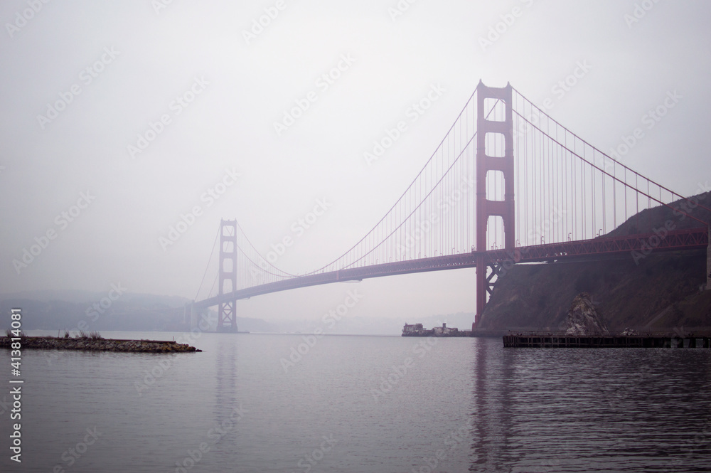 Low angle view of Golden Gate Bridge in foggy weather Low angle view of Golden Gate Bridge in foggy weather