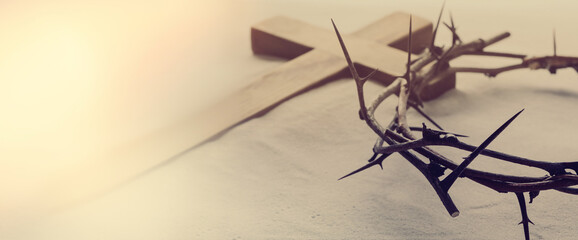 Passion Of Jesus Christ. Crown of thorns and wooden cross on sand, banner design