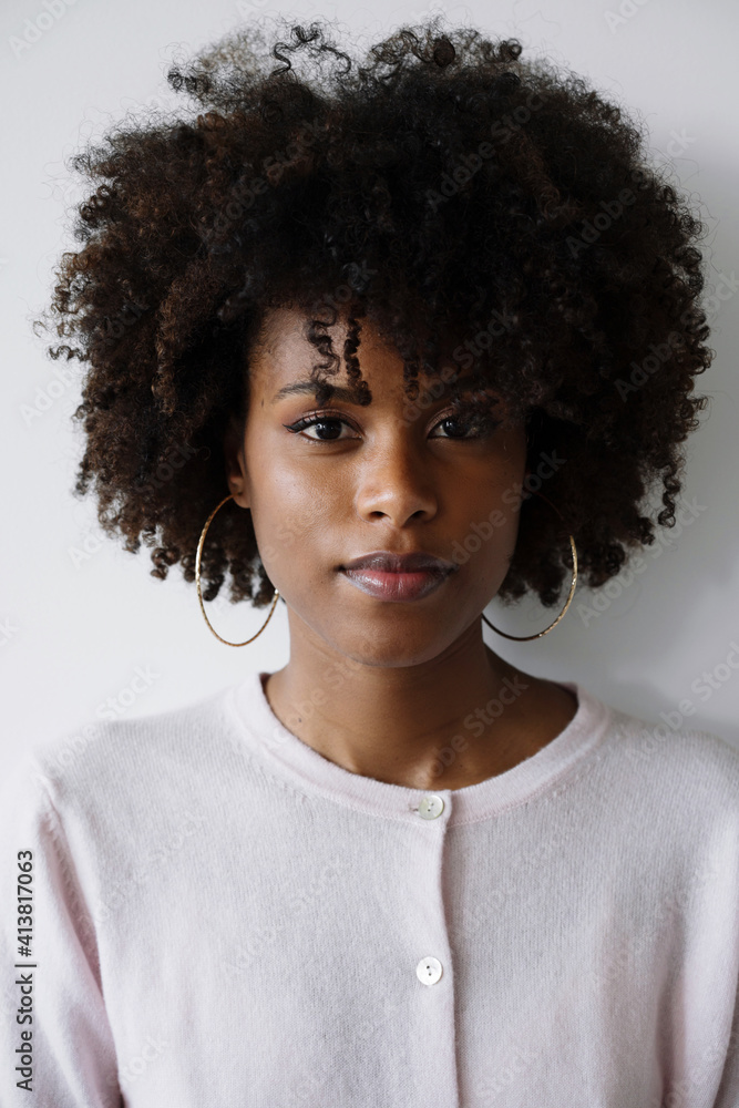 Portrait of a beautiful black woman with afro on the white background Portrait of a beautiful black woman with afro on the white background