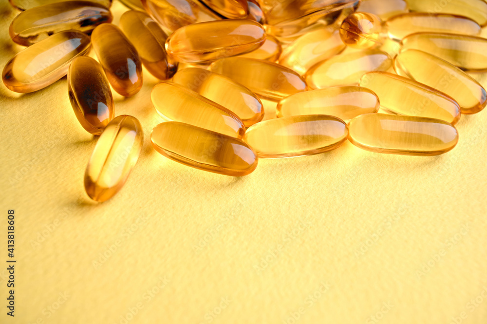 Omega-3 Fish Fat Oil Capsules. Fish oil capsules isolated on white background. Close up of capsules Omega 3 on white background. Health care concept. Nutritional supplements. Vitamins Omega-3 Fish Fat Oil Capsules. Fish oil capsules isolated on white background. Close up of capsules Omega 3 on white background. Health care concept. Nutritional supplements. Vitamins