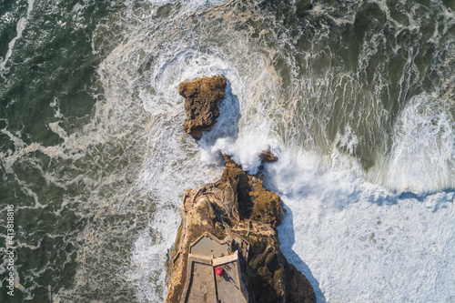Nazaré Headlight from aerial view with enraged sea