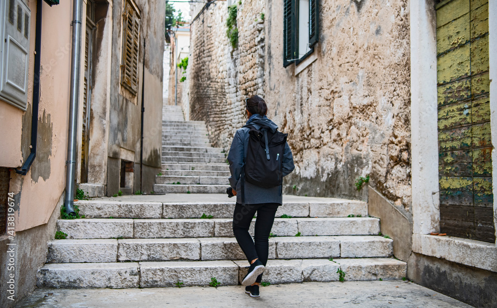 woman walking through