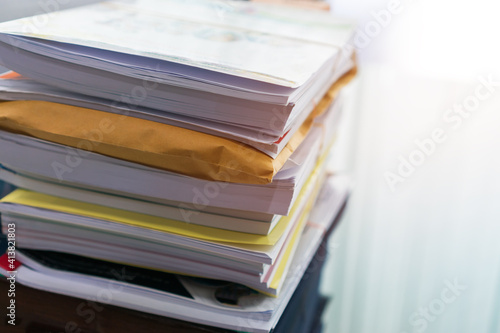 Stack overload documents report papers on teacher desk waiting approve from advisor check, Annual Reports document for evaluation in student study or business paperless concept