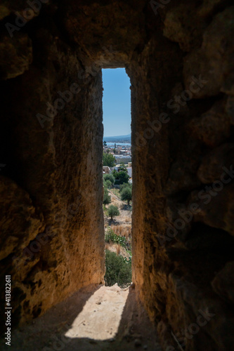 Ruins of old town in Rethymno  Crete  Greece. It largest castle in central Europe. View from the walls window. Port in background