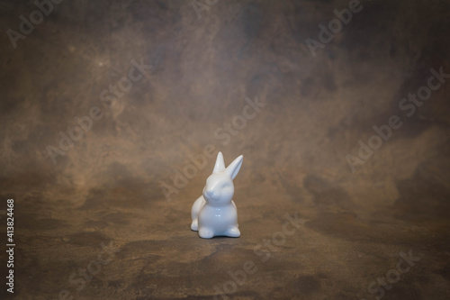 Easter bunny on rustic broun background