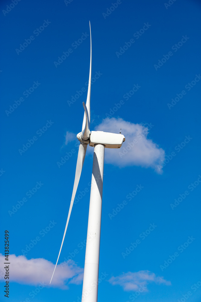 Wind turbine with blue sky and clouds Wind turbine with blue sky and clouds