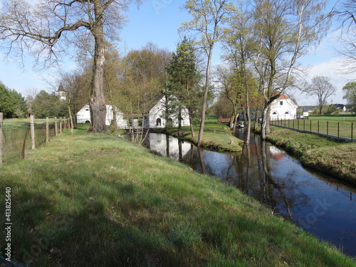 Wallpaper Mural White houses by the river with trees in sunlight. Torontodigital.ca