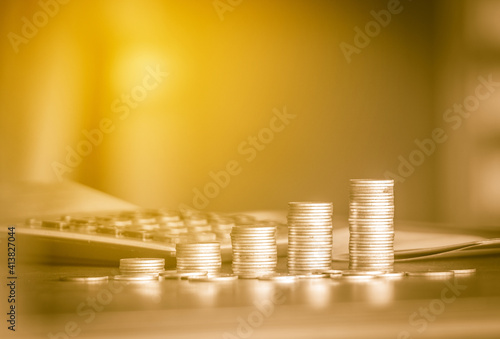 stacks of gold money coin background concept saving money with vintage filter