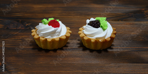 Two sweet baskets with cream photo