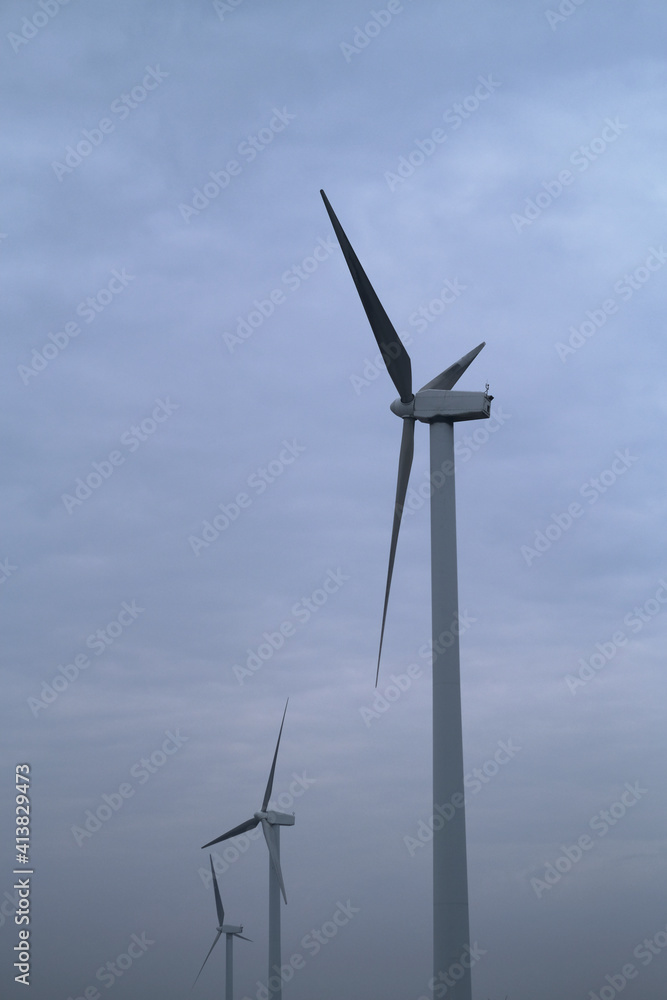 wind power turbine with white cloud sky background wind power turbine with white cloud sky background
