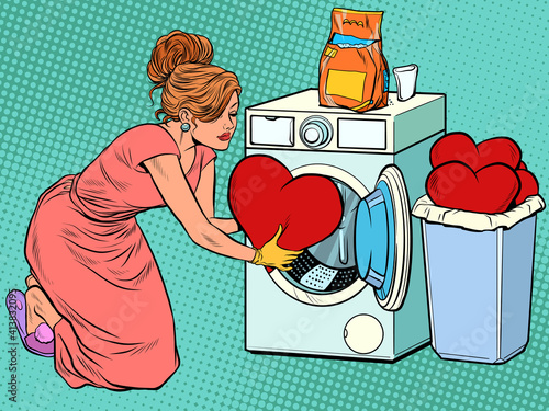 Beautiful woman washes a red heart. Valentines day