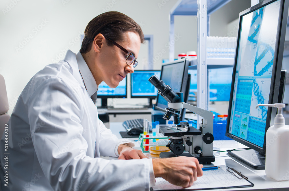 Professional scientist is working on a vaccine in a modern scientific research laboratory. Genetic engineer workplace. Future technology and science. Professional scientist is working on a vaccine in a modern scientific research laboratory. Genetic engineer workplace. Future technology and science.