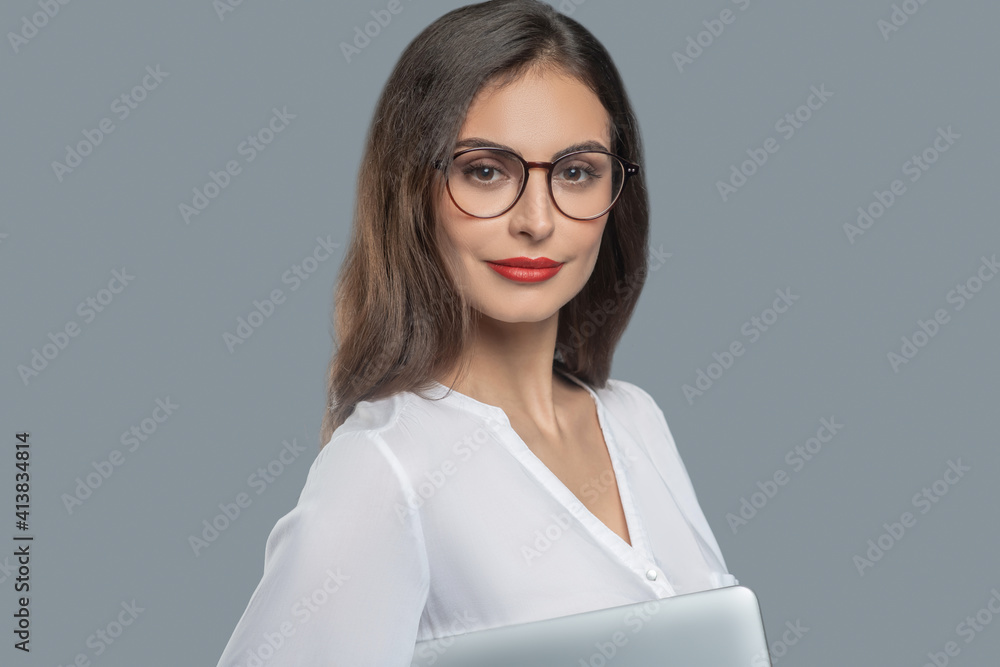 Pretty young business woman in glasses with laptop Pretty young business woman in glasses with laptop
