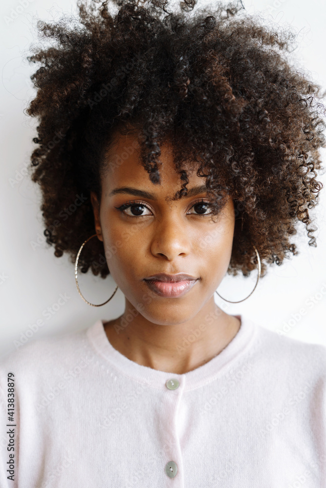 Portrait of a beautiful black woman with afro on the white background Portrait of a beautiful black woman with afro on the white background