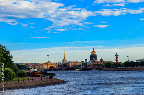 Cityscape of St. Petersburg, Russia. View of the Neva river, Palace bridge, St. Isaac Cathedral, the Admiralty and Spit of Vasilyevsky Island with Rostral columns in Saint Petersburg, Russia