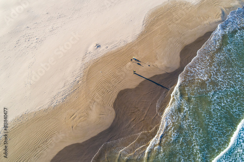 Aerial abstract view of Valencia beach with waves and wet sand photo