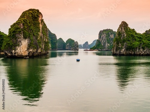 Stunning view of Halong Bay karst formations reflected in the emerald waters of Tonkin gulf, Vietnam 