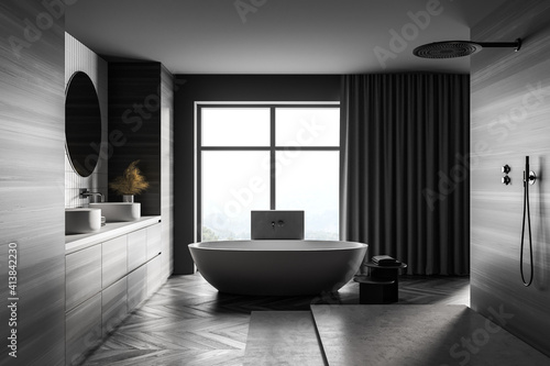 Wooden grey bathroom with white bathtub  shower and sinks near window