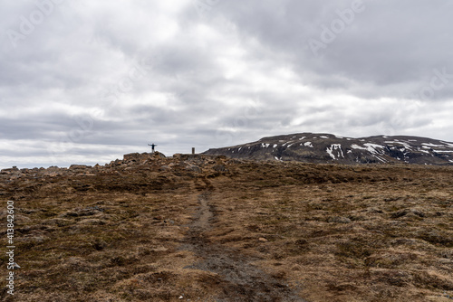 Man standing in the distance at Uxahryggjavegur Iceland, Kaldidalur valley, road 52 to Fanntófell, Iceland highlands, with rough volcanic landscape