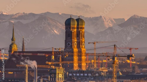 Munich frauenkirche zoom time lapse from day to night, munich skyline aerial view, alps mountain. photo