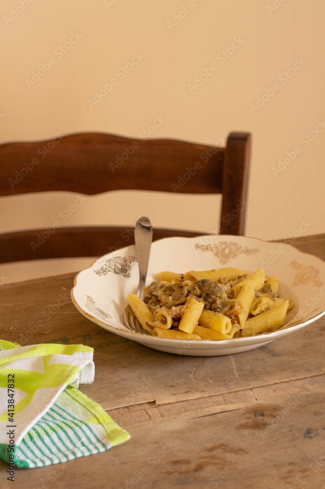 Artichoke pasta with some bread on top