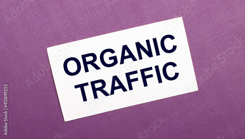 On a lilac background, a white card with the words ORGANIC TRAFFIC