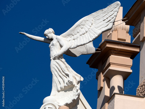 Konstfotografi victory fascism angel statue on the top of old building