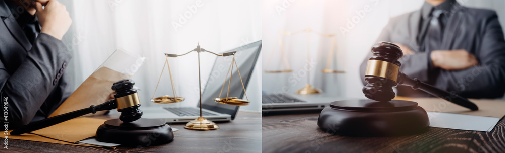Justice and law concept.Male judge in a courtroom with the gavel, working with, computer and docking keyboard, eyeglasses, on table in morning light Justice and law concept.Male judge in a courtroom with the gavel, working with, computer and docking keyboard, eyeglasses, on table in morning light