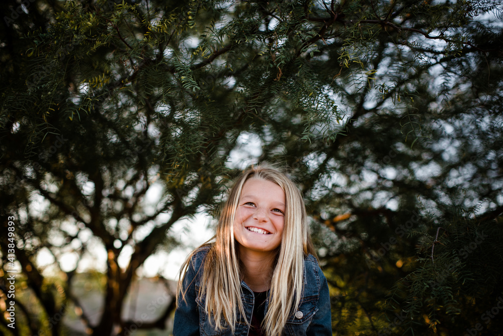 Young Girl Looking Up and Smiling in Southern California Young Girl Looking Up and Smiling in Southern California