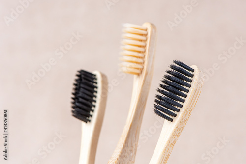 Eco friendly bamboo toothbrushes close up on brown background. Zero waste concept