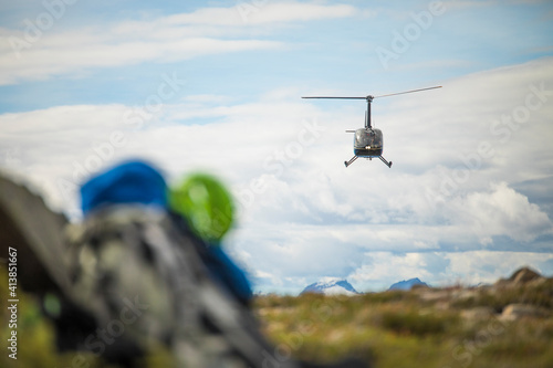 Helicopter flying above the Coast Mountain Range, B.C., Canada.