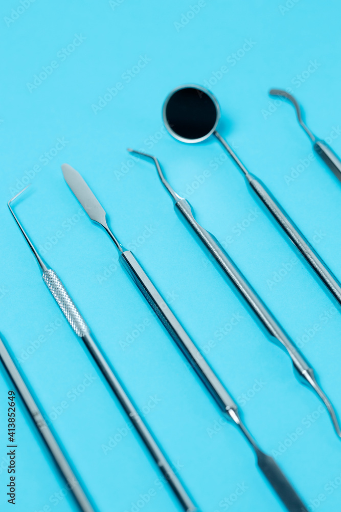 Dental instruments on blue backdrop. close-up Dental instruments on blue backdrop. close-up