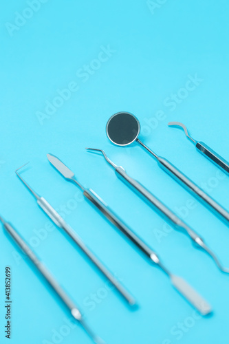 Dental instruments set on dentistry blue background. close-up