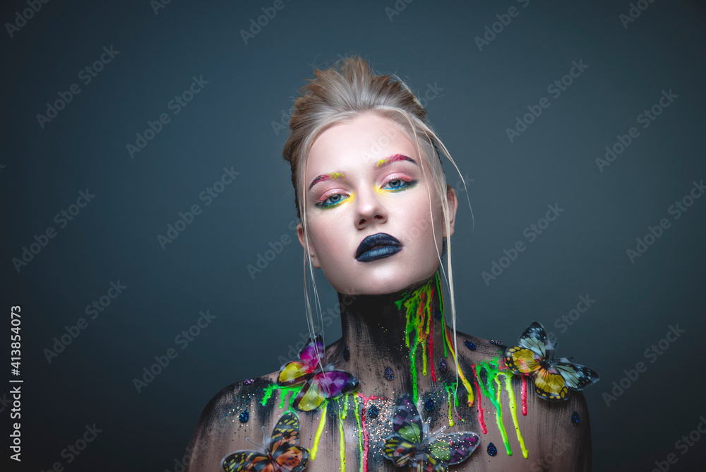 Young girl with creative makeup with butterflies Young girl with creative makeup with butterflies