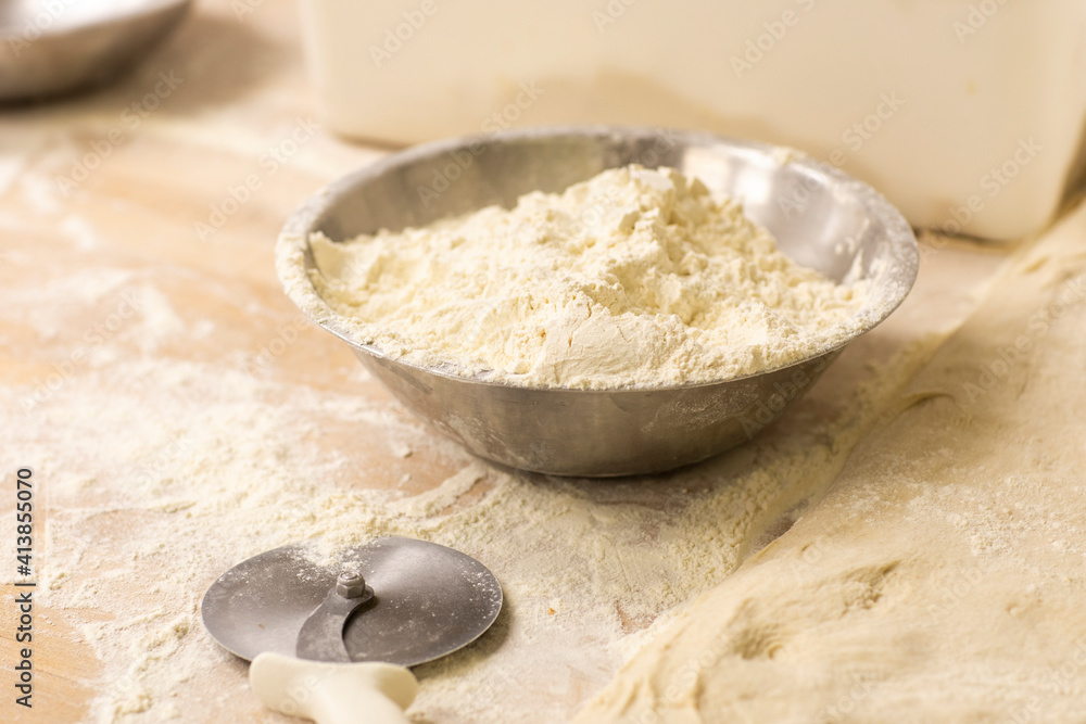 Flour used for making fresh bread sits in bowl Flour used for making fresh bread sits in bowl